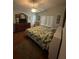 Cozy bedroom with a ceiling fan, wood floors and large dresser at 2127 N.E. 40Th Ave., Ocala, FL 34470