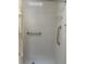 Accessible walk-in shower with safety grab bars and tiled walls at 2127 N.E. 40Th Ave., Ocala, FL 34470