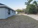 View of a spacious backyard, partially grassed with fencing in the distance at 227 Locust Rd, Ocala, FL 34472