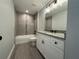 Updated bathroom featuring modern vanity and tiled tub/shower combo at 227 Locust Rd, Ocala, FL 34472