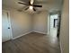 Bedroom featuring light colored walls, ceiling fan and luxury vinyl flooring at 227 Locust Rd, Ocala, FL 34472