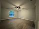Bedroom featuring light colored walls, ceiling fan and luxury vinyl flooring at 227 Locust Rd, Ocala, FL 34472