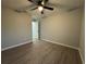 Bedroom featuring light colored walls, ceiling fan and luxury vinyl flooring at 227 Locust Rd, Ocala, FL 34472