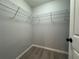 Walk in closet with laminate wood flooring and adjustable metal shelving at 227 Locust Rd, Ocala, FL 34472