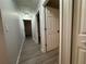Hallway featuring light colored walls and luxury vinyl flooring at 227 Locust Rd, Ocala, FL 34472