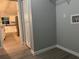 This laundry room has vinyl flooring and a utility sink, just off of the kitchen at 227 Locust Rd, Ocala, FL 34472