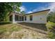 Private backyard featuring a screened patio and ample space for outdoor activities at 2312 Sw 140Th Ct, Ocala, FL 34481