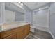Bathroom featuring tub/shower combo, vanity, toilet, and wood-look floors at 2312 Sw 140Th Ct, Ocala, FL 34481