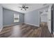 Bedroom featuring a ceiling fan, window, and wood-look floors at 2312 Sw 140Th Ct, Ocala, FL 34481