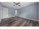 Bedroom with wood-look floors and neutral walls at 2312 Sw 140Th Ct, Ocala, FL 34481