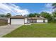 Inviting single-story home with a well-kept lawn and a convenient two-car garage at 2312 Sw 140Th Ct, Ocala, FL 34481