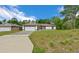 Charming single-story home with a well-manicured lawn and inviting curb appeal at 2312 Sw 140Th Ct, Ocala, FL 34481
