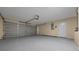 Large, clean garage with epoxy flooring, perfect for parking and storage at 2312 Sw 140Th Ct, Ocala, FL 34481