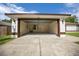Spacious two-car garage with ample room for parking and storage, with wash basin at 2312 Sw 140Th Ct, Ocala, FL 34481