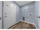 Laundry room featuring a wire rack for storage, and a door to the outside at 2312 Sw 140Th Ct, Ocala, FL 34481