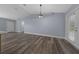 Open living room features modern flooring, light blue walls, and ample natural light at 2312 Sw 140Th Ct, Ocala, FL 34481