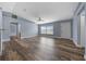 Inviting living room with hardwood floors, fan, and lots of natural light from the windows at 2312 Sw 140Th Ct, Ocala, FL 34481