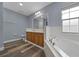 Spa-like main bathroom features a double sink vanity and separate tub at 2312 Sw 140Th Ct, Ocala, FL 34481
