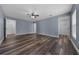 Light-filled main bedroom with wood floors and an ensuite bathroom and walk-in closet at 2312 Sw 140Th Ct, Ocala, FL 34481