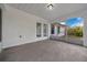 Spacious screened porch with tile flooring, ideal for enjoying the outdoors at 2312 Sw 140Th Ct, Ocala, FL 34481