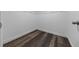 Walk-in closet with modern wood-look floors and custom shelving for optimal storage at 2312 Sw 140Th Ct, Ocala, FL 34481