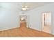 Bright bedroom featuring french doors and views into the bathroom and kitchen at 2339 Nw 55Th Avenue Rd, Ocala, FL 34482