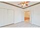 Bright bedroom featuring a ceiling fan, closet, and french doors leading to another room at 2339 Nw 55Th Avenue Rd, Ocala, FL 34482