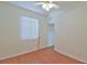 Comfortable bedroom with wood-look flooring and ample natural light through a window at 2339 Nw 55Th Avenue Rd, Ocala, FL 34482