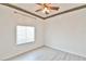 Bedroom with a ceiling fan and a bright window with blinds at 2339 Nw 55Th Avenue Rd, Ocala, FL 34482