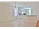 Tiled dining room with a chandelier and breakfast bar overlooking the kitchen, creating a functional and inviting space at 2339 Nw 55Th Avenue Rd, Ocala, FL 34482