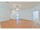 Spacious living room with wood flooring, neutral walls, and an open layout, creating a versatile living space at 2339 Nw 55Th Avenue Rd, Ocala, FL 34482