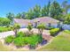 Beautiful home with a well-maintained front yard, lush landscaping, and a driveway for a welcoming curb appeal at 2410 Se 23Rd Pl, Ocala, FL 34471