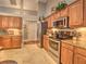 Well-equipped kitchen featuring stainless steel appliances, custom cabinets, and granite countertops with ample counter space at 2410 Se 23Rd Pl, Ocala, FL 34471