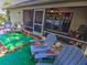 Inviting outdoor patio with comfortable seating and landscaped features at 2410 Se 23Rd Pl, Ocala, FL 34471