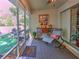 Screened porch with comfortable seating, perfect for enjoying the outdoors at 2410 Se 23Rd Pl, Ocala, FL 34471
