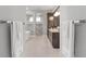 Modern bathroom with dual vanity, soaking tub, and glass-enclosed shower at 2515 Se 77Th St, Ocala, FL 34480