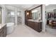 Elegant bathroom with soaking tub, walk-in shower, dual vanity, and walk-in closet at 2515 Se 77Th St, Ocala, FL 34480