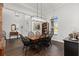 Elegant dining room featuring hardwood floors and a stylish light fixture at 2515 Se 77Th St, Ocala, FL 34480