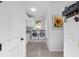 Well-organized laundry room with modern washer and dryer, functional storage, and natural light at 2515 Se 77Th St, Ocala, FL 34480