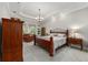 Spacious main bedroom featuring a tray ceiling and ample natural light at 2515 Se 77Th St, Ocala, FL 34480