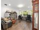 Spacious home office with wood floors, dual workstations, large windows, and bookshelves at 2515 Se 77Th St, Ocala, FL 34480