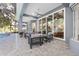 Covered patio features comfortable seating with a view into the home and access to the pool at 2515 Se 77Th St, Ocala, FL 34480