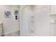 Clean bathroom with white tile shower, neutral wall color, and white shower curtain at 2864 Ne 21St Court Rd, Ocala, FL 34470