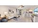 Open-concept living room with stylish decor, modern furniture, and a seamless transition to the kitchen at 2864 Ne 21St Court Rd, Ocala, FL 34470