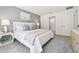 Light-filled main bedroom with a large window and neutral decor, creating a serene atmosphere at 2929 Ne 21St Terrace Rd, Ocala, FL 34470