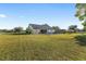 Spacious backyard with a well-manicured lawn, a fenced pool, and a charming view of the rear of the house at 4083 Se 38Th Loop, Ocala, FL 34480