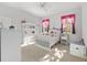 Bright bedroom with white furniture, charming decor, and plenty of natural light from the windows at 4083 Se 38Th Loop, Ocala, FL 34480