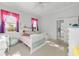 Cozy bedroom with bright windows and white furniture, creating a peaceful and inviting atmosphere at 4083 Se 38Th Loop, Ocala, FL 34480
