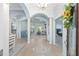 Spacious foyer showcasing elegant archways, tile flooring, a chandelier, and open views to the living areas and bedrooms at 4083 Se 38Th Loop, Ocala, FL 34480