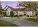 Charming single-story home boasts a meticulously landscaped yard and inviting curb appeal, enhanced by a well-lit walkway at 4083 Se 38Th Loop, Ocala, FL 34480